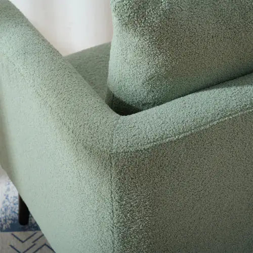Poltrona imbottita con gambe in legno massello